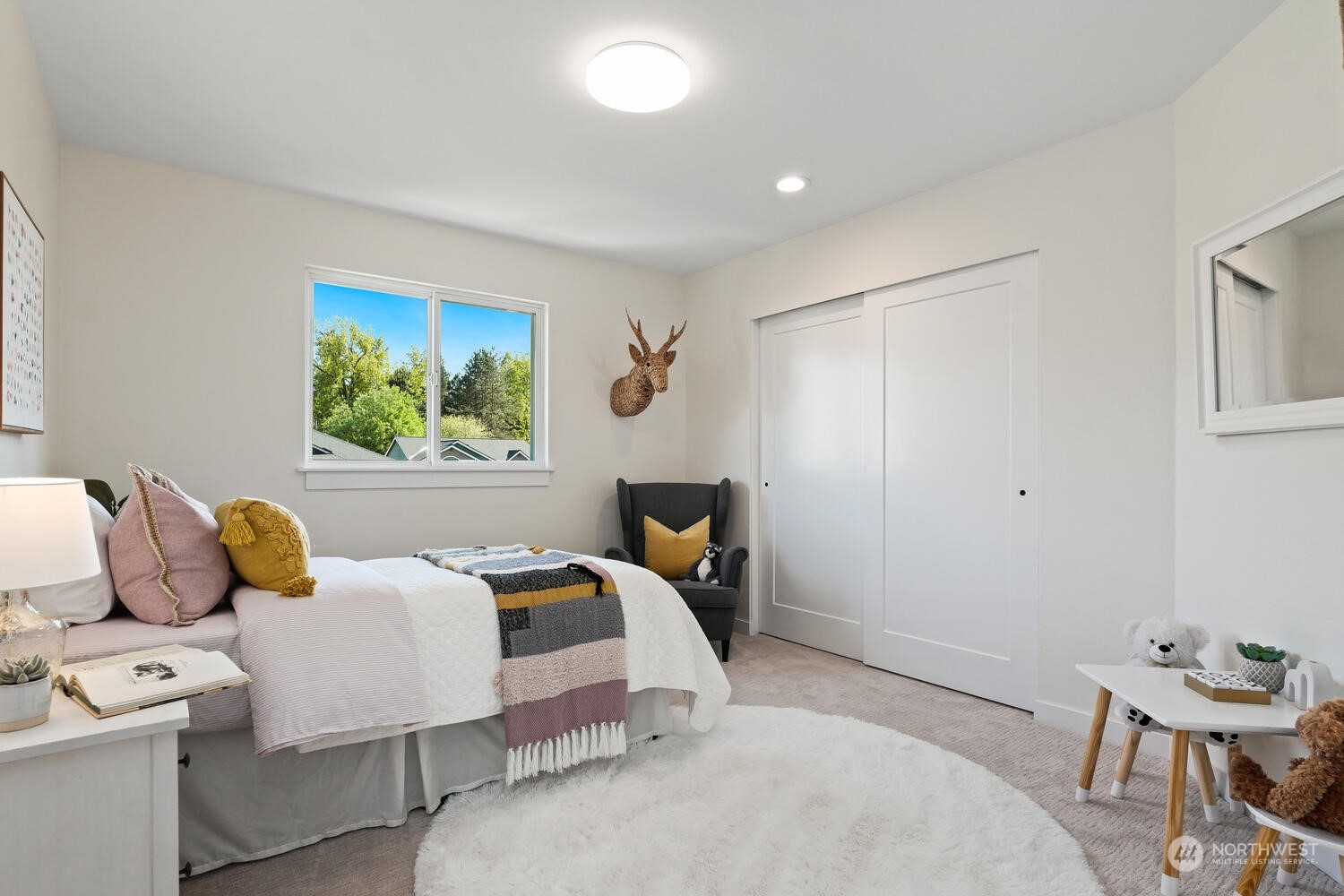 1332 237th Place Southwest Bothell, WA 98021 - Photo 25 of 29 a bedroom with a bed and a window