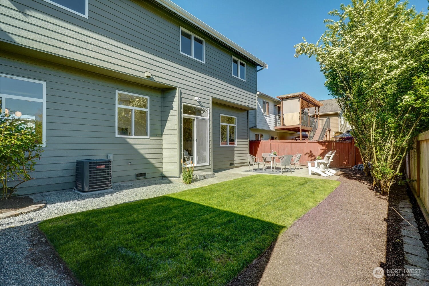 1332 237th Place Southwest Bothell, WA 98021 - Photo 29 of 29 a backyard of a house with table and chairs