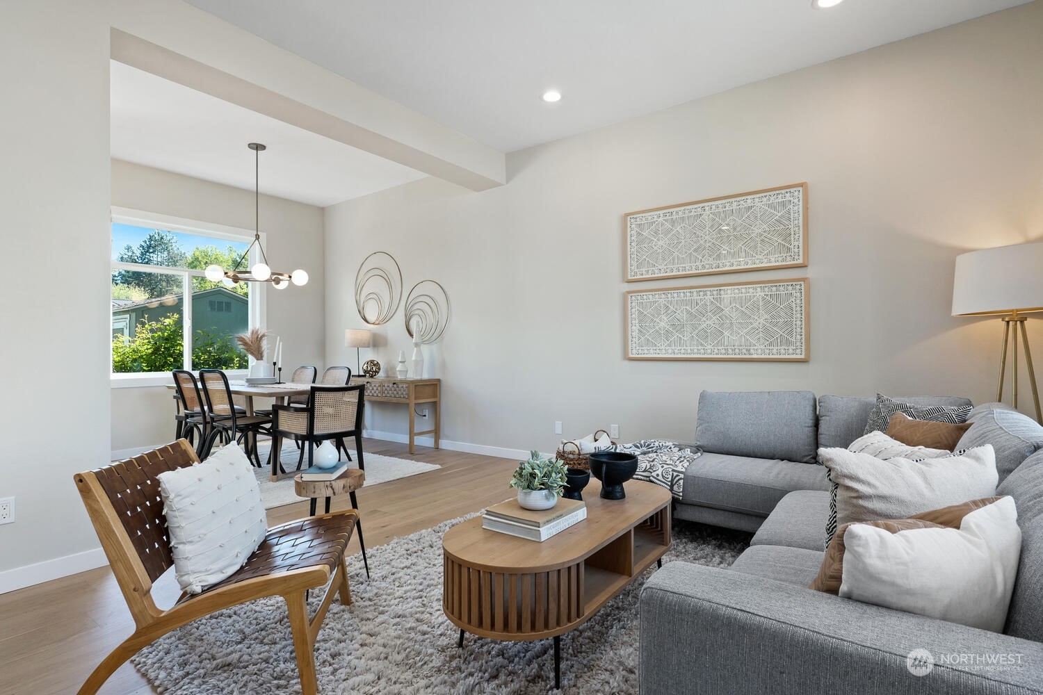 1332 237th Place Southwest Bothell, WA 98021 - Photo 6 of 29 a living room with furniture and a chandelier