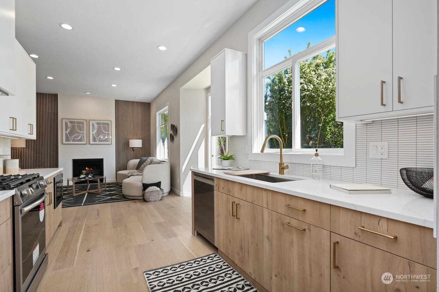 1332 237th Place Southwest Bothell, WA 98021 - Photo 10 of 29 a kitchen with sink refrigerator and stove top oven