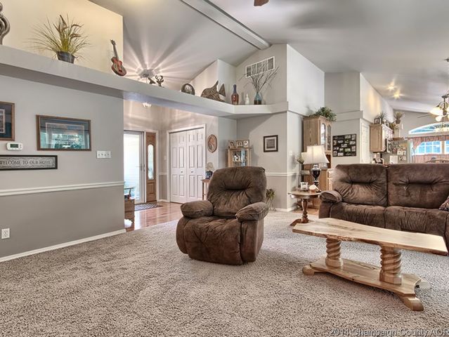 7841 Buttercup Road Weldon, IL 61882 - Photo 3 of 24 a living room with furniture and a chandelier