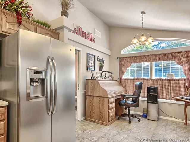 7841 Buttercup Road Weldon, IL 61882 - Photo 6 of 24 a kitchen with refrigerator and window