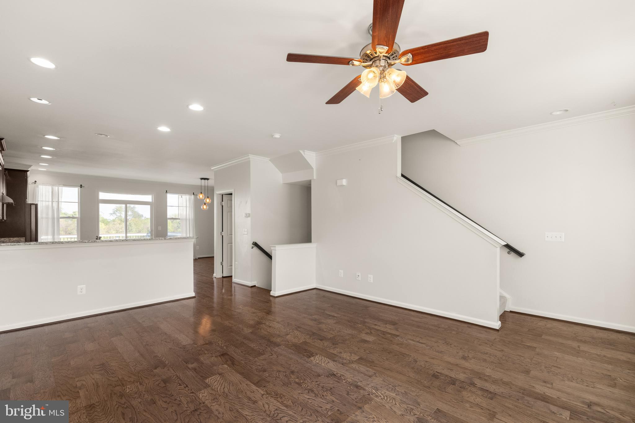 111 Rotunda Drive Stephenson, VA 22656 - Photo 12 of 33 an empty room with wooden floor and windows