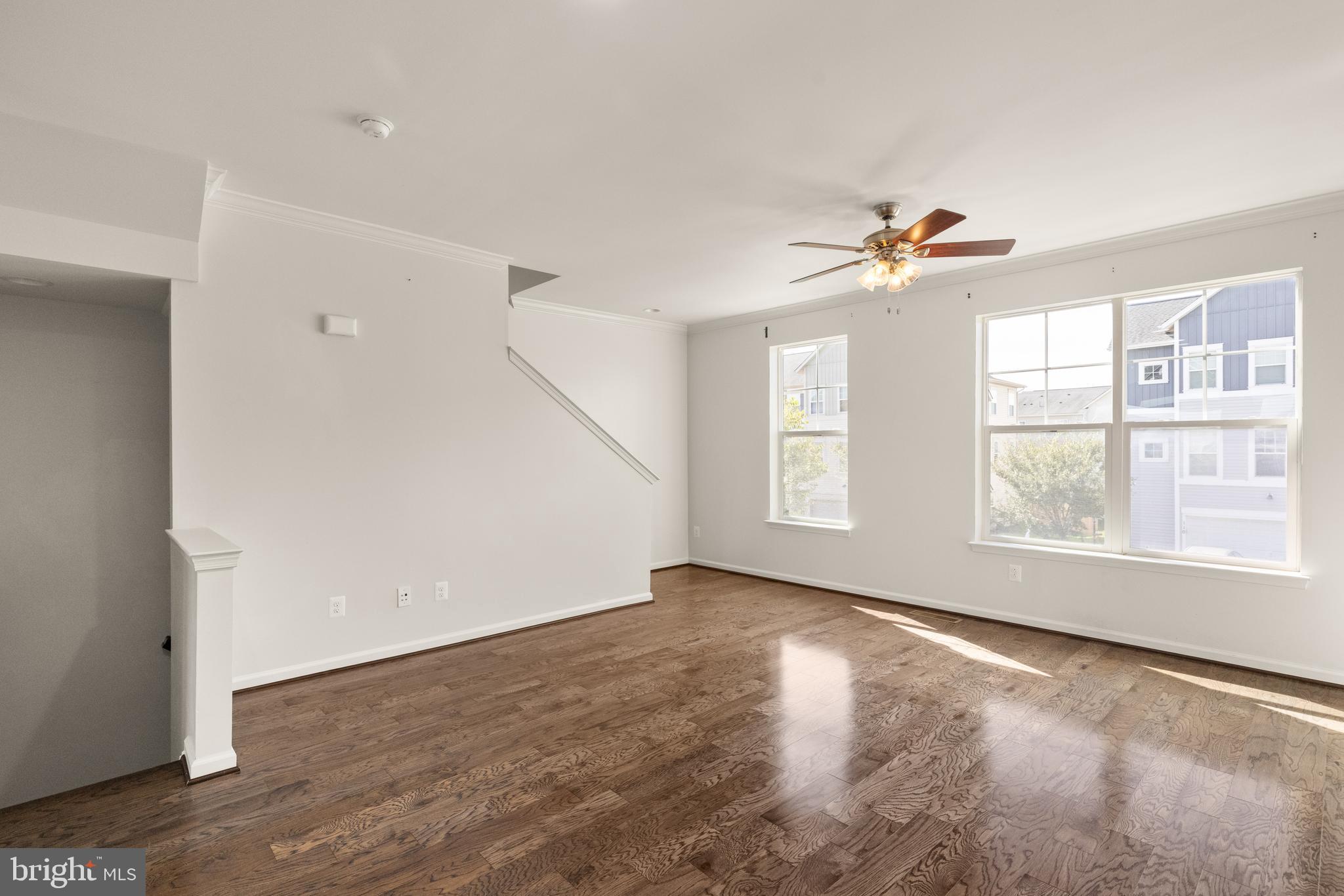 111 Rotunda Drive Stephenson, VA 22656 - Photo 13 of 33 an empty room with windows and chandelier fan