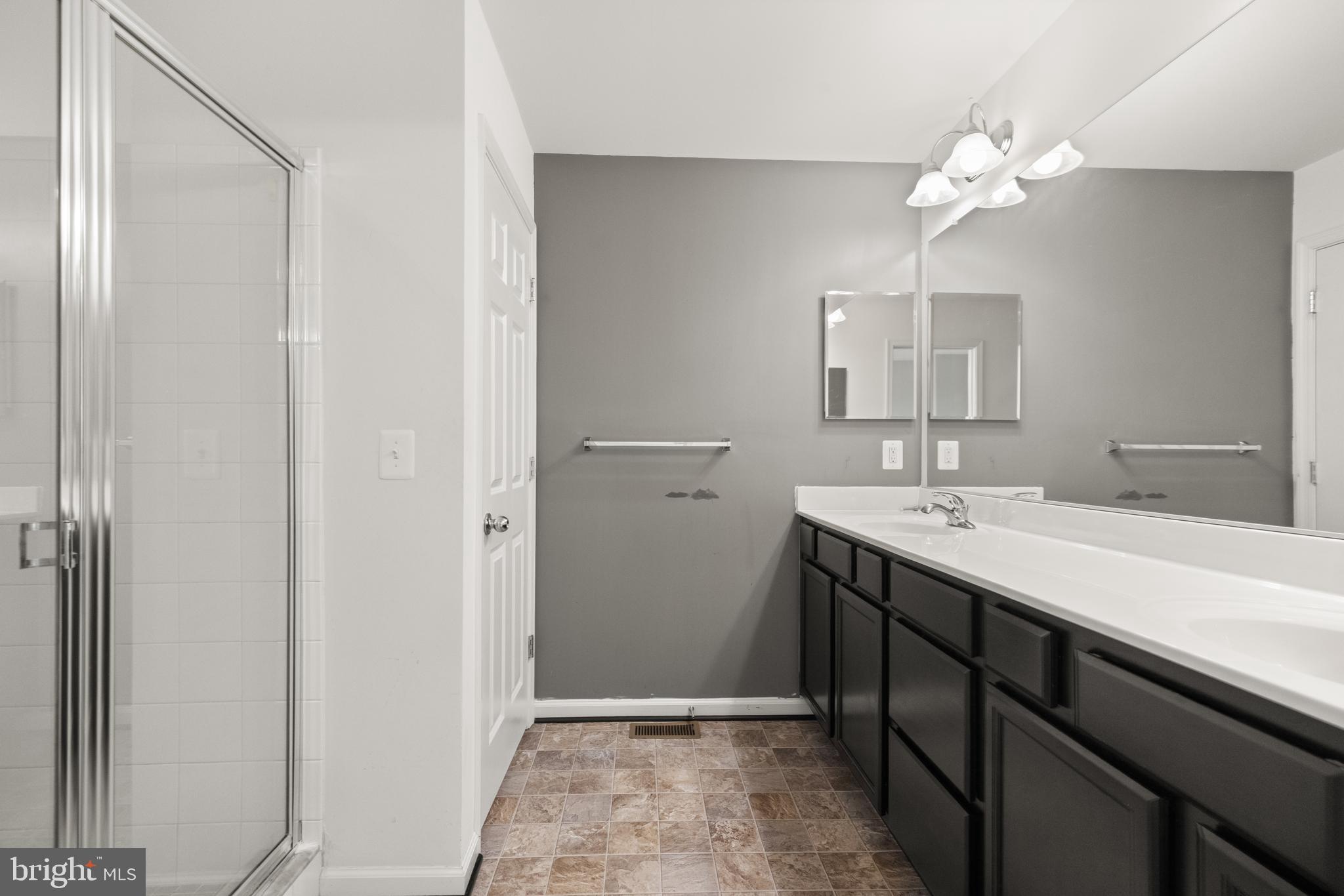 111 Rotunda Drive Stephenson, VA 22656 - Photo 21 of 33 a bathroom with a sink vanity and a mirror