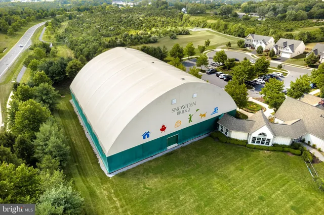 a view of a swimming pool with a lawn chairs