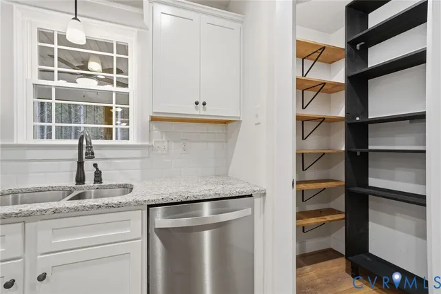 a kitchen with a sink and a window