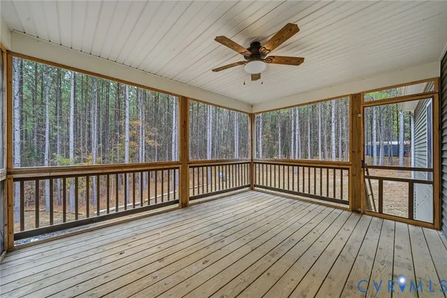 a view of a porch with wooden floor