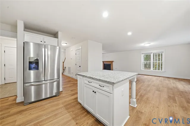 a kitchen with a refrigerator and a sink