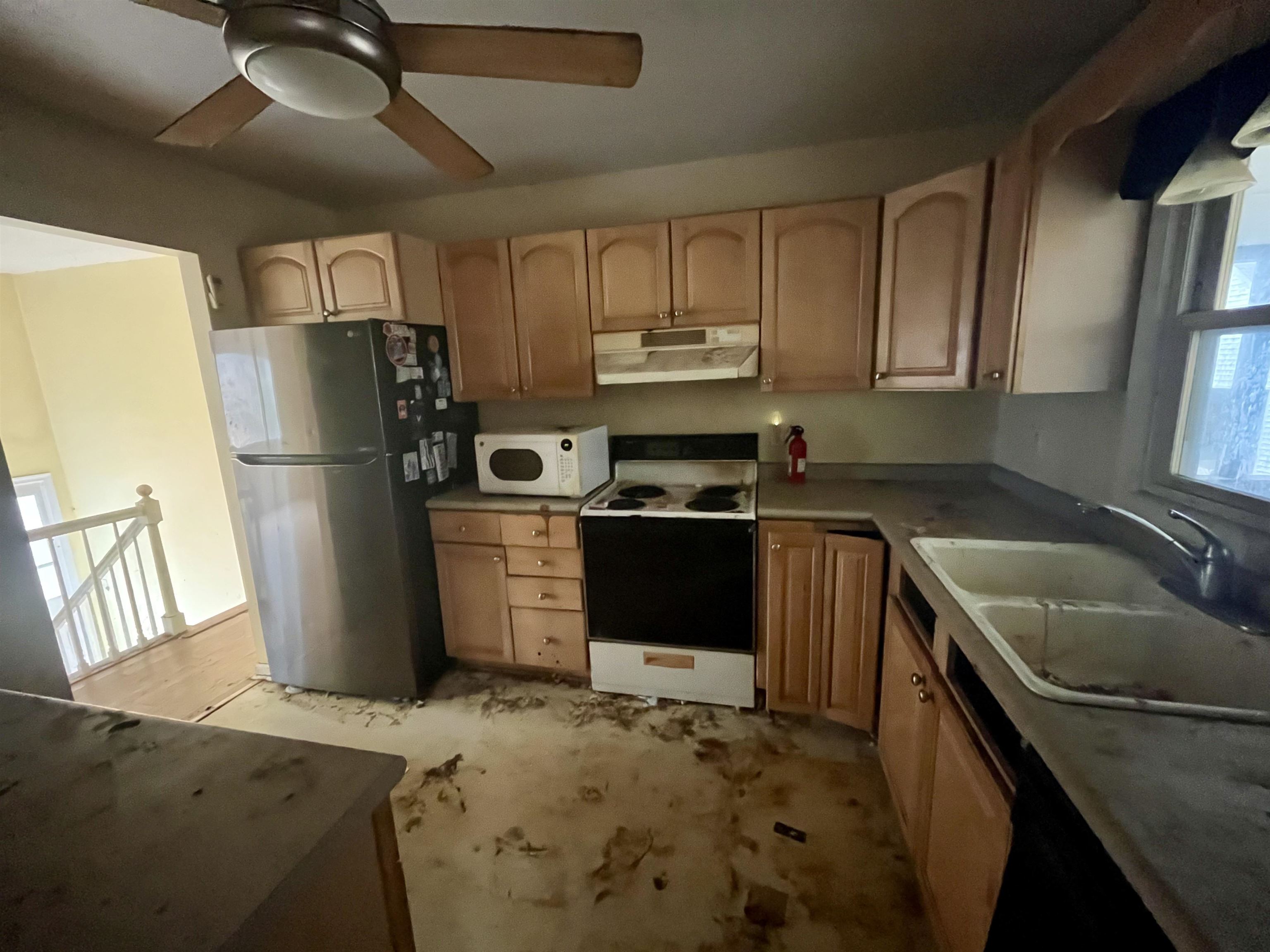 3672 Airport Acres Road Charlottesville, VA 22911 - Photo 15 of 49 a kitchen with a refrigerator sink and stove