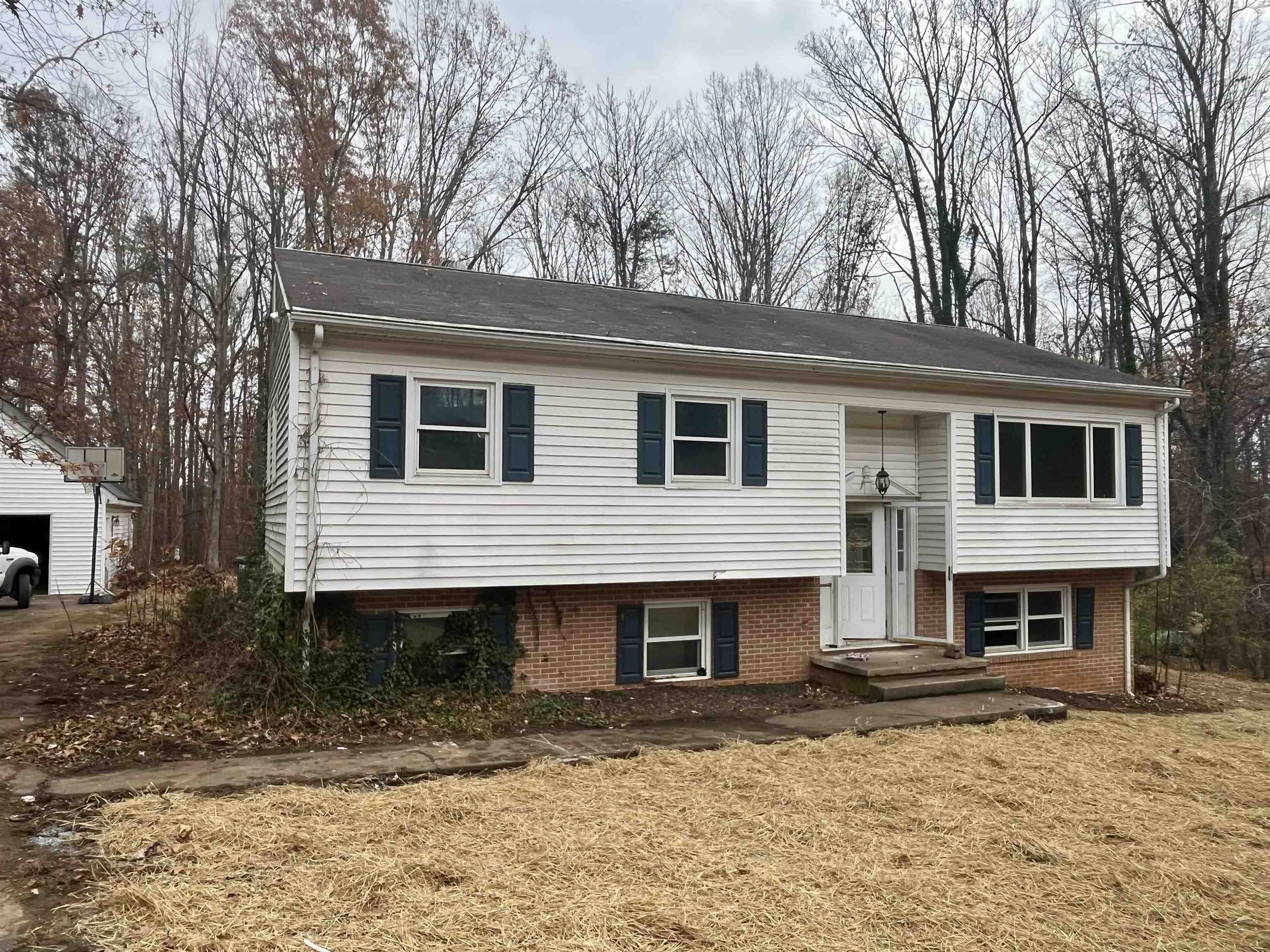 3672 Airport Acres Road Charlottesville, VA 22911 - Photo 39 of 49 a front view of a house with a yard and garage