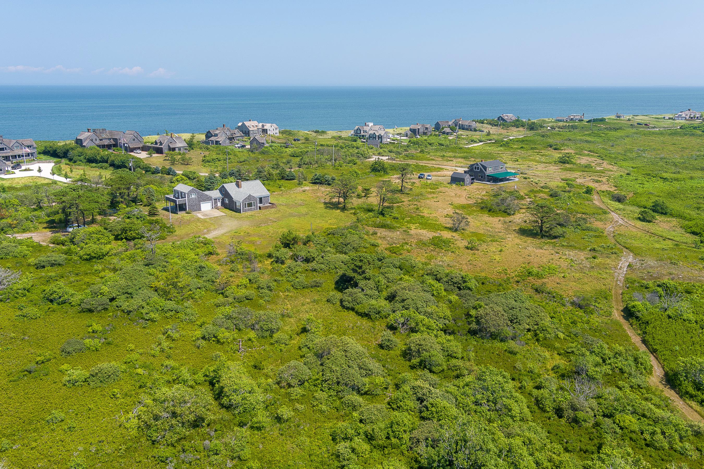 118 Eel Point Road Nantucket, MA 02554 - Photo 2 of 16 a view of a lake with houses