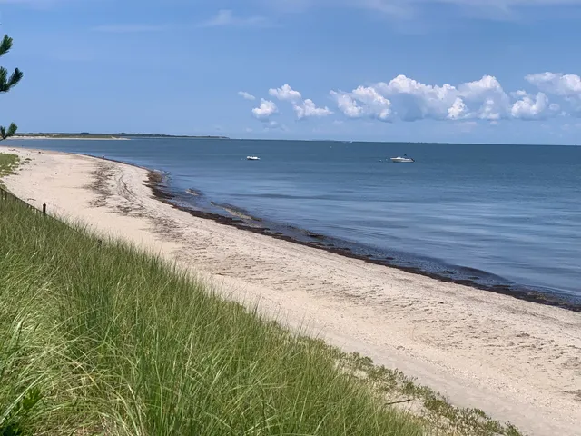 an aerial view of swimming pool patio and mountain view in back