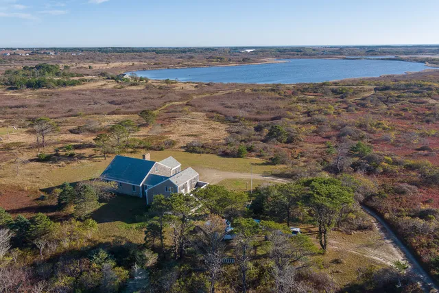an aerial view of house with beach
