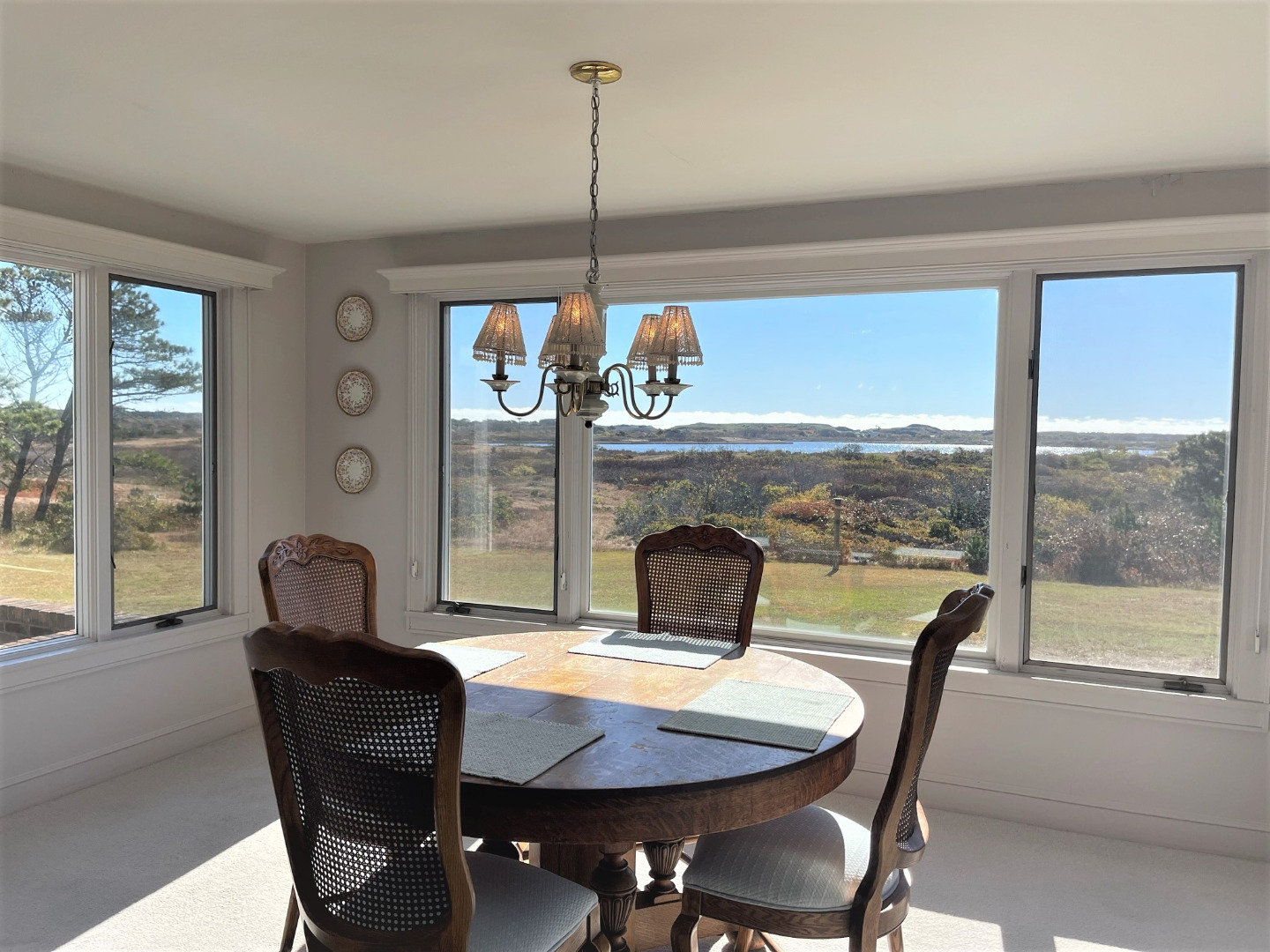 118 Eel Point Road Nantucket, MA 02554 - Photo 9 of 16 a view of a dining room with furniture window and outside view