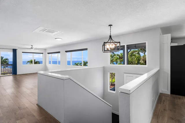 a view of an entryway with kitchen