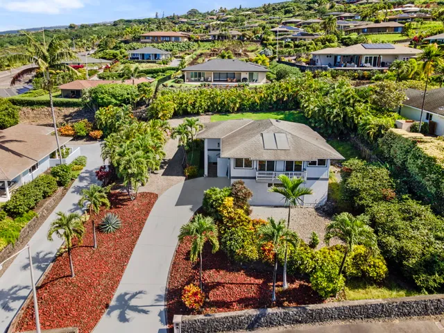 an aerial view of a house with a garden