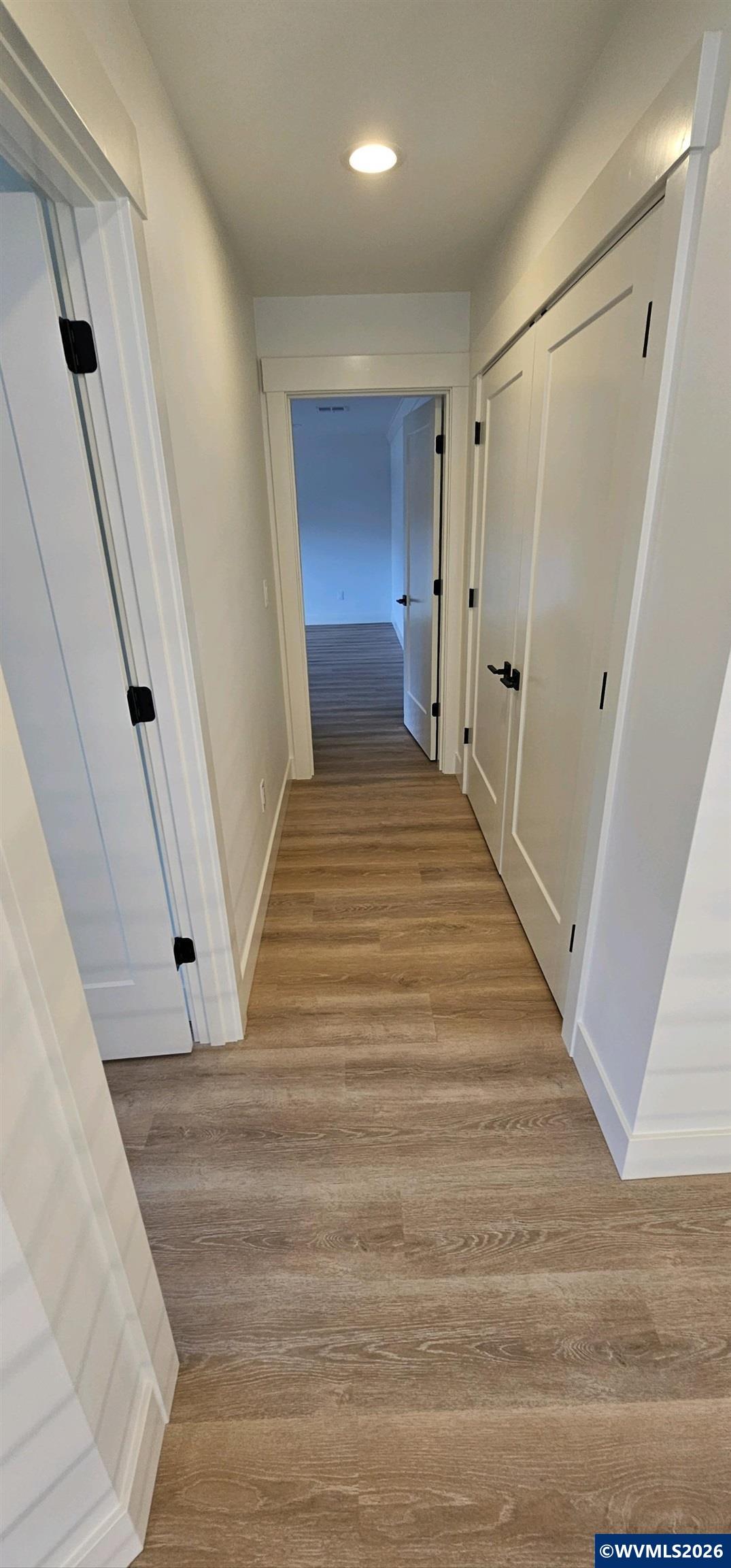 Model B Salishan Street Southeast Salem, OR 97302 - Photo 21 of 30 a view of a hallway with wooden floor and staircase