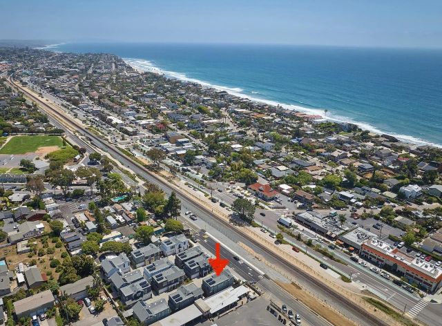 an aerial view of beach and ocean