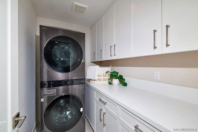a kitchen with a cabinets and a sink