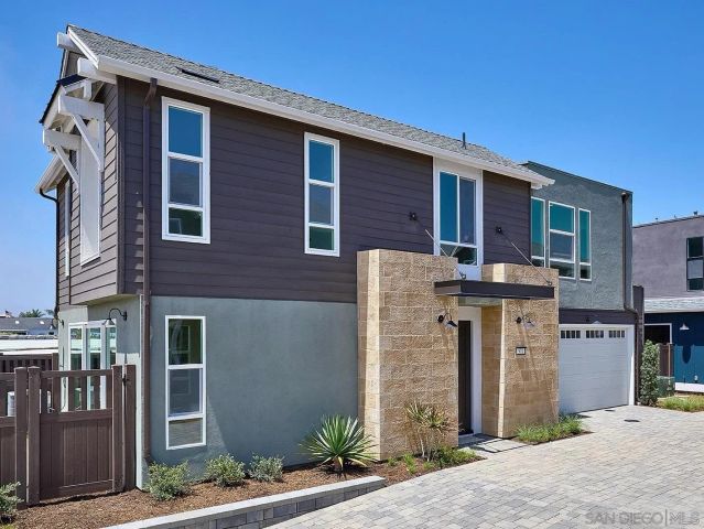 a front view of a house with garage
