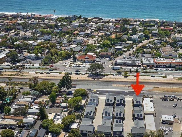 a view of a street with car parked