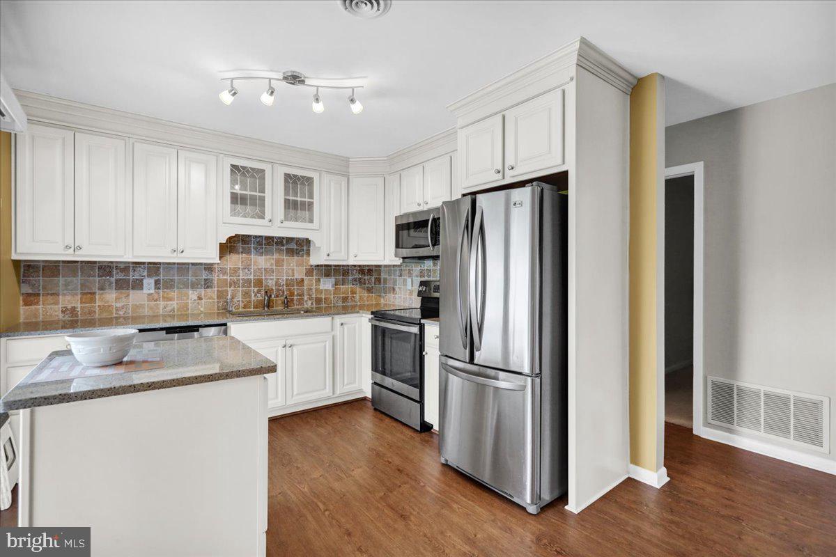 112 Brown Street Reading, PA 19606 - Photo 12 of 32 a kitchen with refrigerator a sink and cabinets