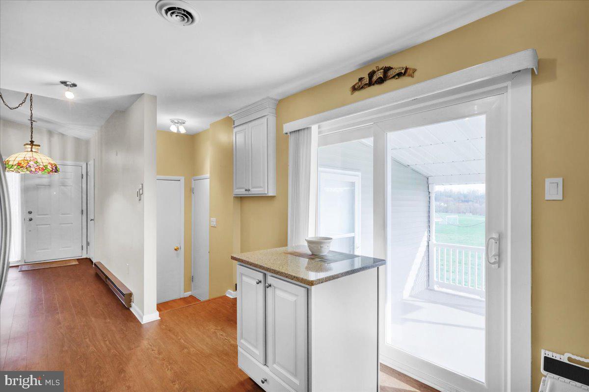 112 Brown Street Reading, PA 19606 - Photo 16 of 32 a bathroom with a granite countertop sink a mirror and shower