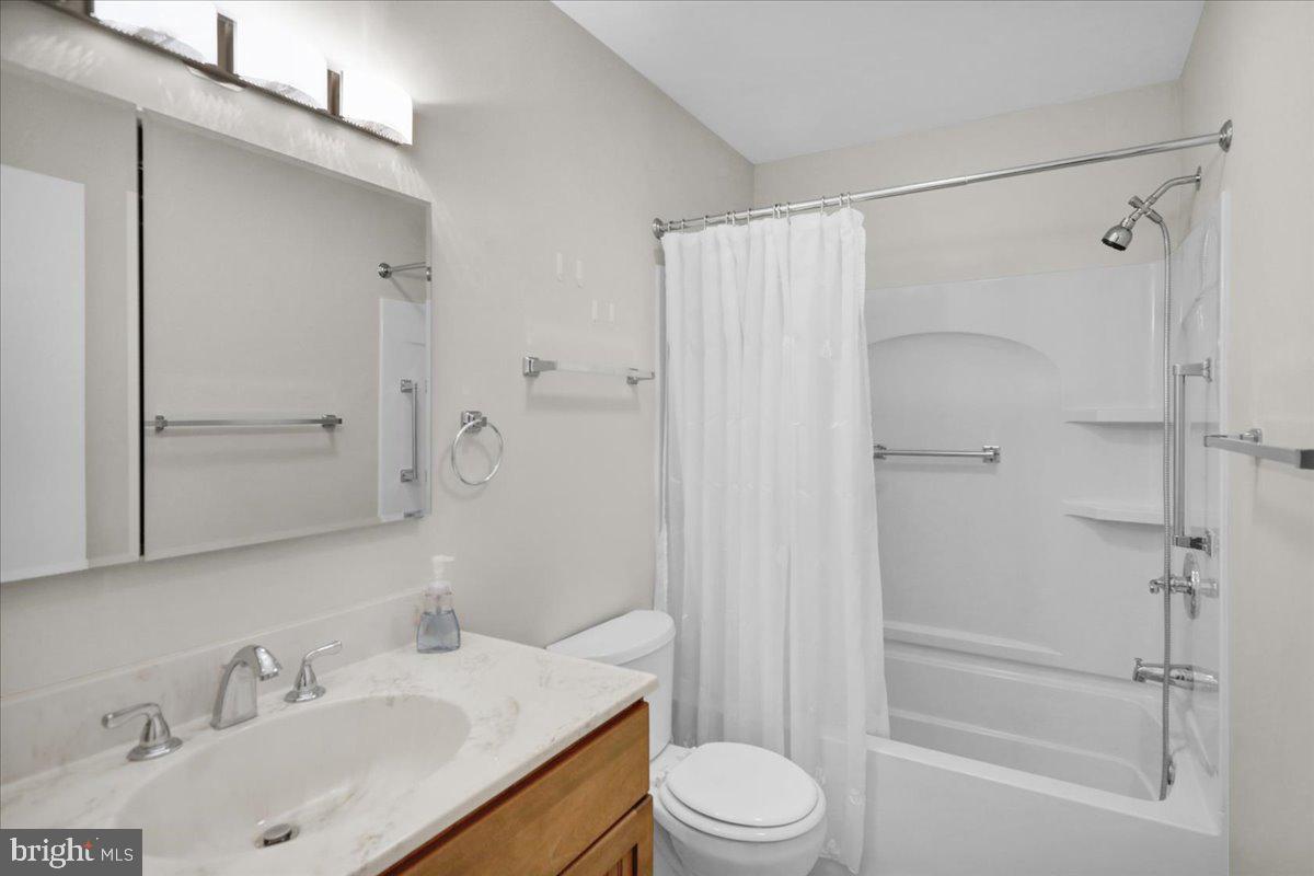 112 Brown Street Reading, PA 19606 - Photo 19 of 32 a bathroom with a sink toilet and shower