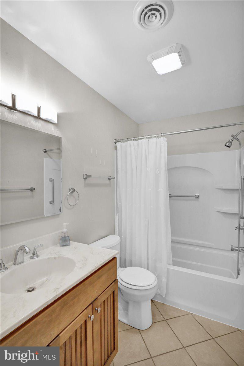 112 Brown Street Reading, PA 19606 - Photo 20 of 32 a bathroom with a sink a toilet and shower