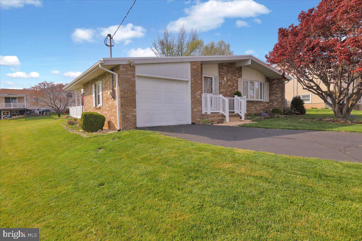112 Brown Street Reading, PA 19606 - Photo 2 of 32 a front view of house with yard and green space