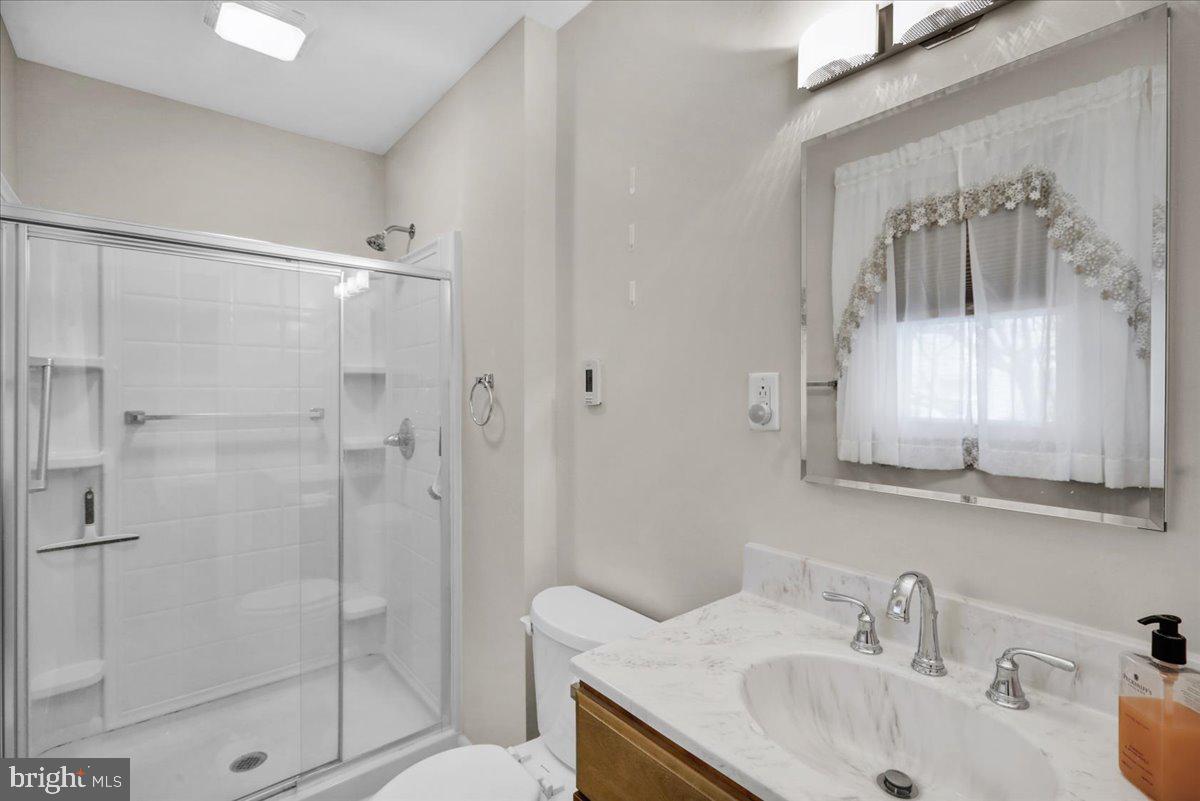 112 Brown Street Reading, PA 19606 - Photo 23 of 32 a bathroom with a sink a toilet and shower