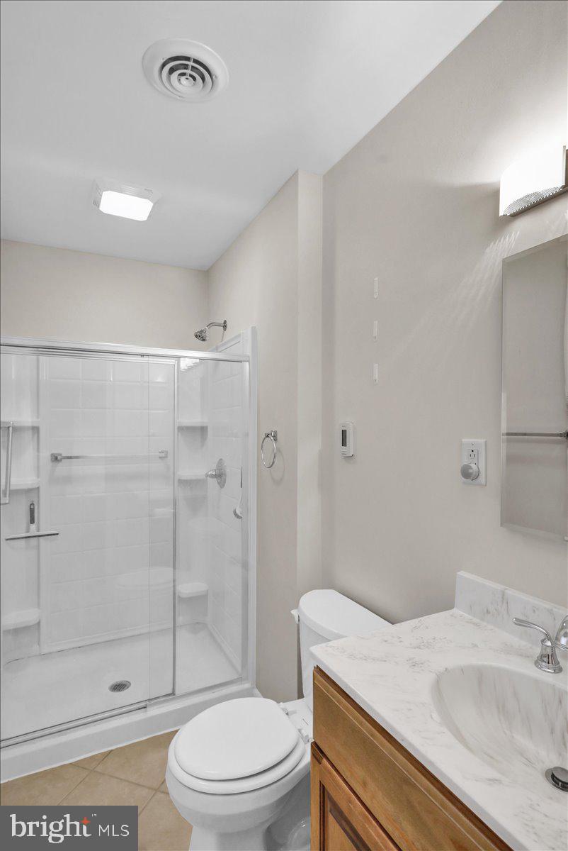 112 Brown Street Reading, PA 19606 - Photo 24 of 32 a bathroom with a sink a toilet and shower