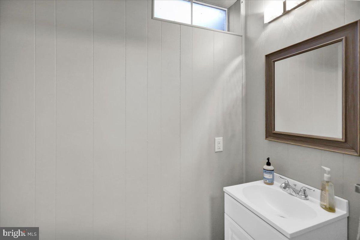 112 Brown Street Reading, PA 19606 - Photo 30 of 32 a bathroom with a sink and a mirror