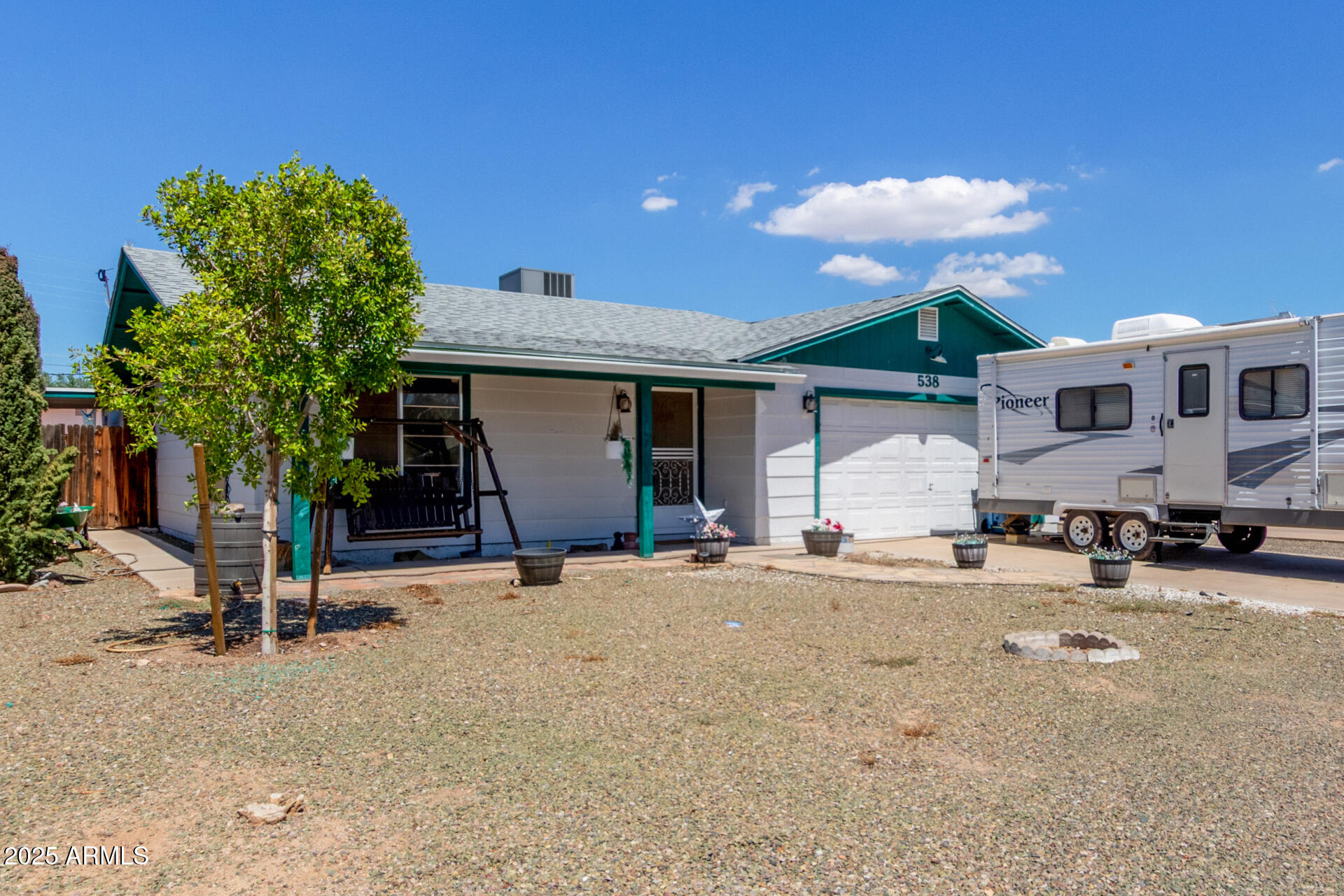 538 East Fred Avenue Apache Junction, AZ 85119 - Photo 2 of 20 a view of a house with a patio and a yard