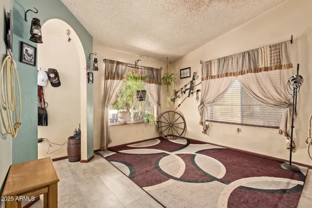 a view of a livingroom with furniture and garage