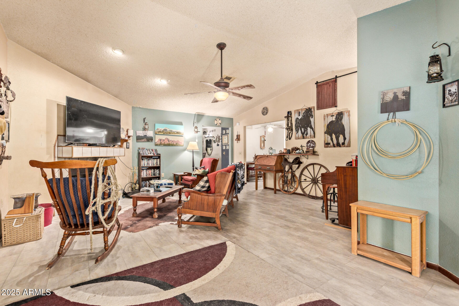 538 East Fred Avenue Apache Junction, AZ 85119 - Photo 4 of 20 a living room with furniture a flat screen tv and kitchen view