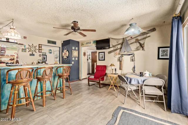 a living room filled with furniture and wooden floor