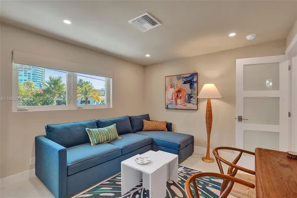 a living room with furniture and a window