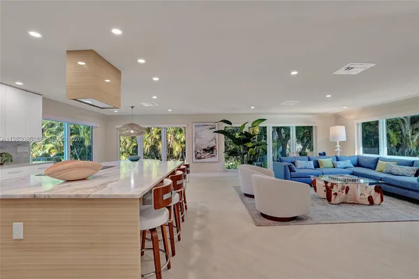 a living room with furniture and a gym