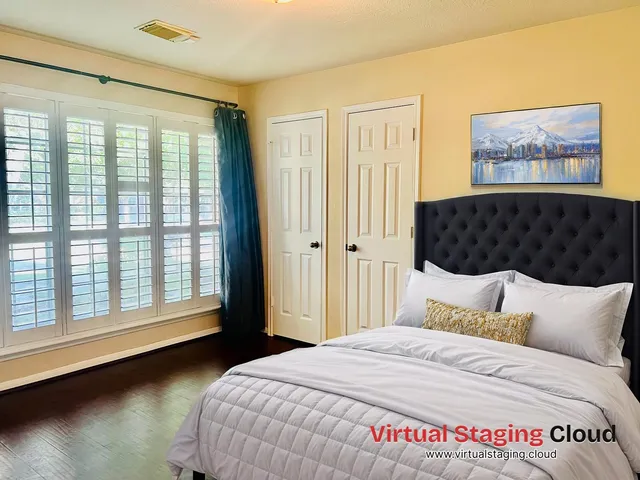 a bedroom with a bed and a window