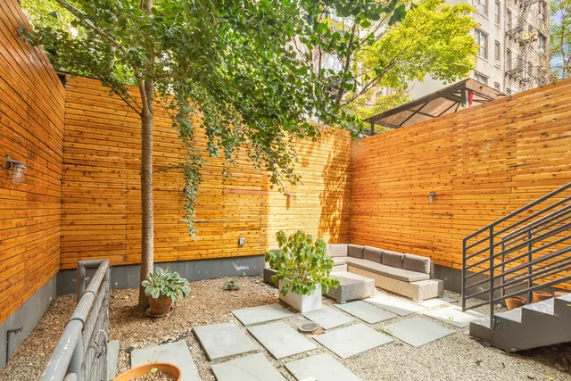 a view of a pathway along with potted plants