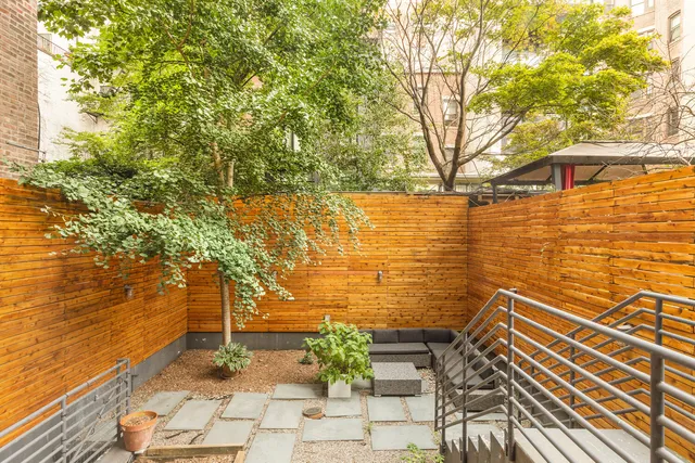 a view of a yard with an outdoor space