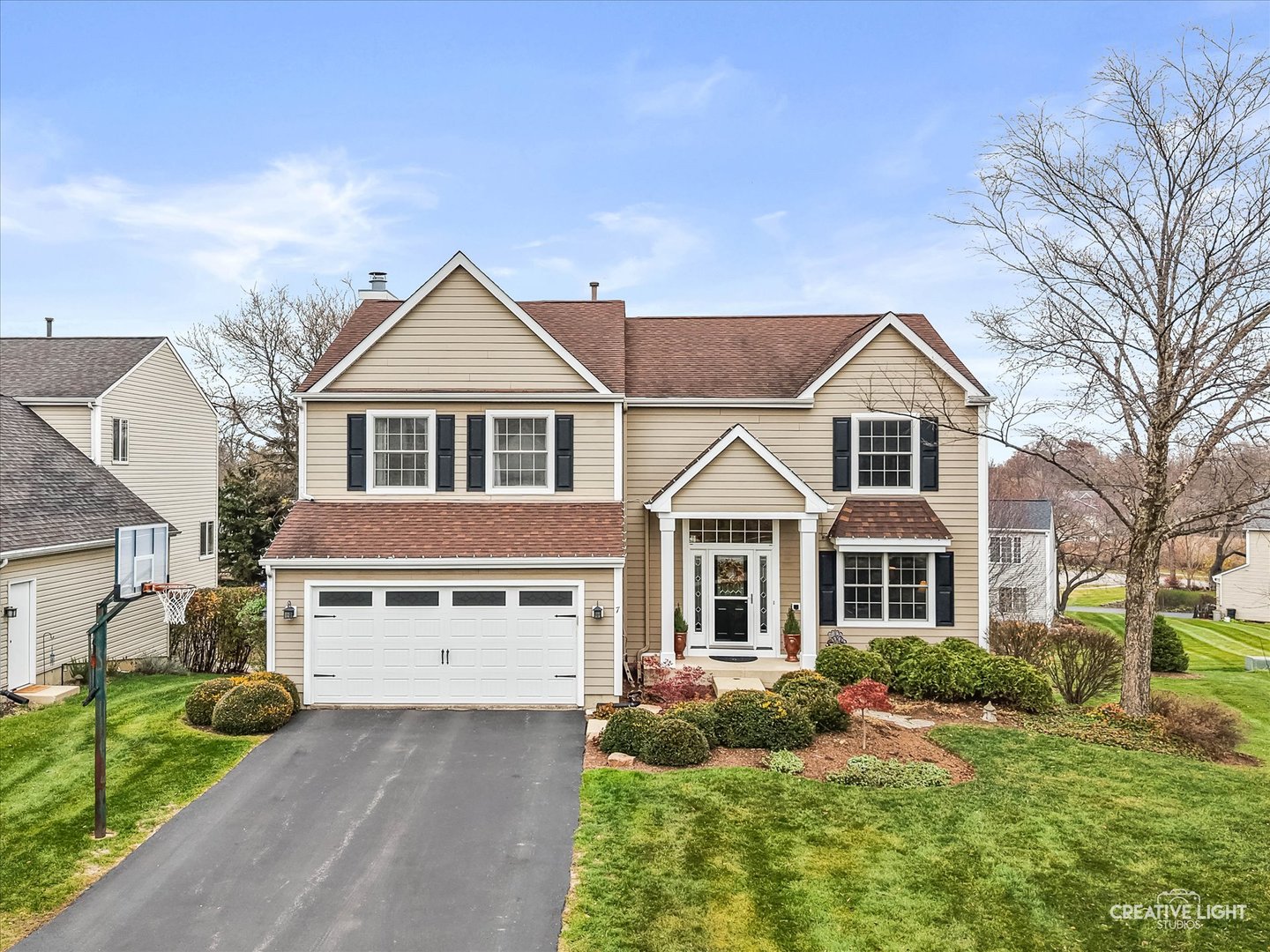 7 Falcon Ridge Court Algonquin, IL 60102 - Photo 2 of 51 a front view of a house with a yard