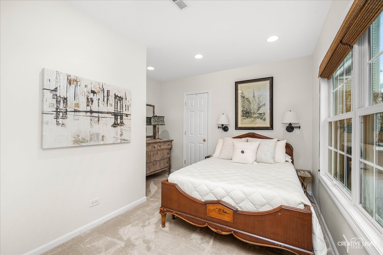 7 Falcon Ridge Court Algonquin, IL 60102 - Photo 22 of 51 a bedroom with a large bed and paintings on the wall
