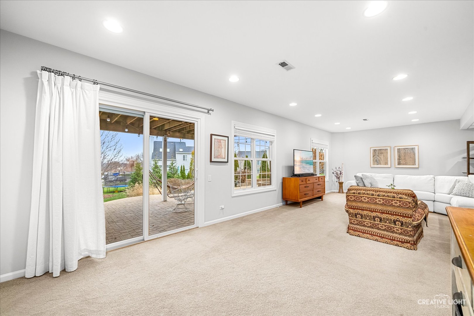 7 Falcon Ridge Court Algonquin, IL 60102 - Photo 24 of 51 a living room with furniture and a large window