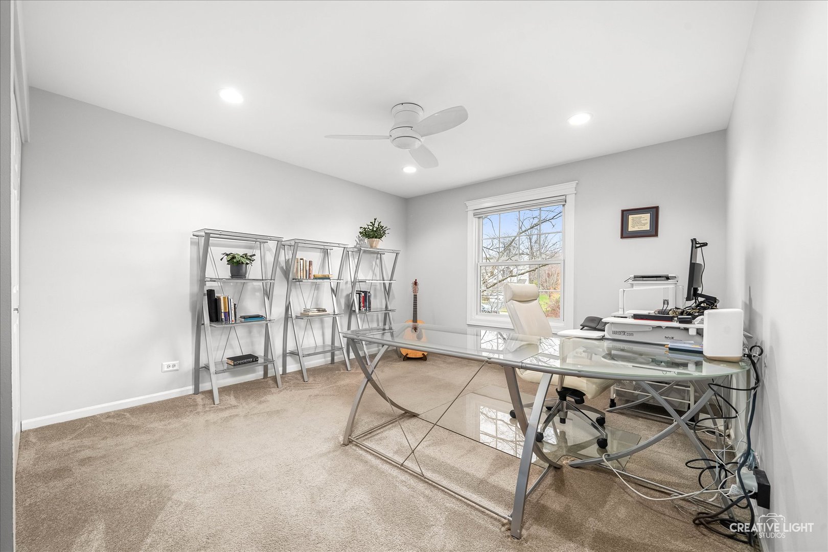 7 Falcon Ridge Court Algonquin, IL 60102 - Photo 27 of 51 a living room with furniture a large window and gym equipment