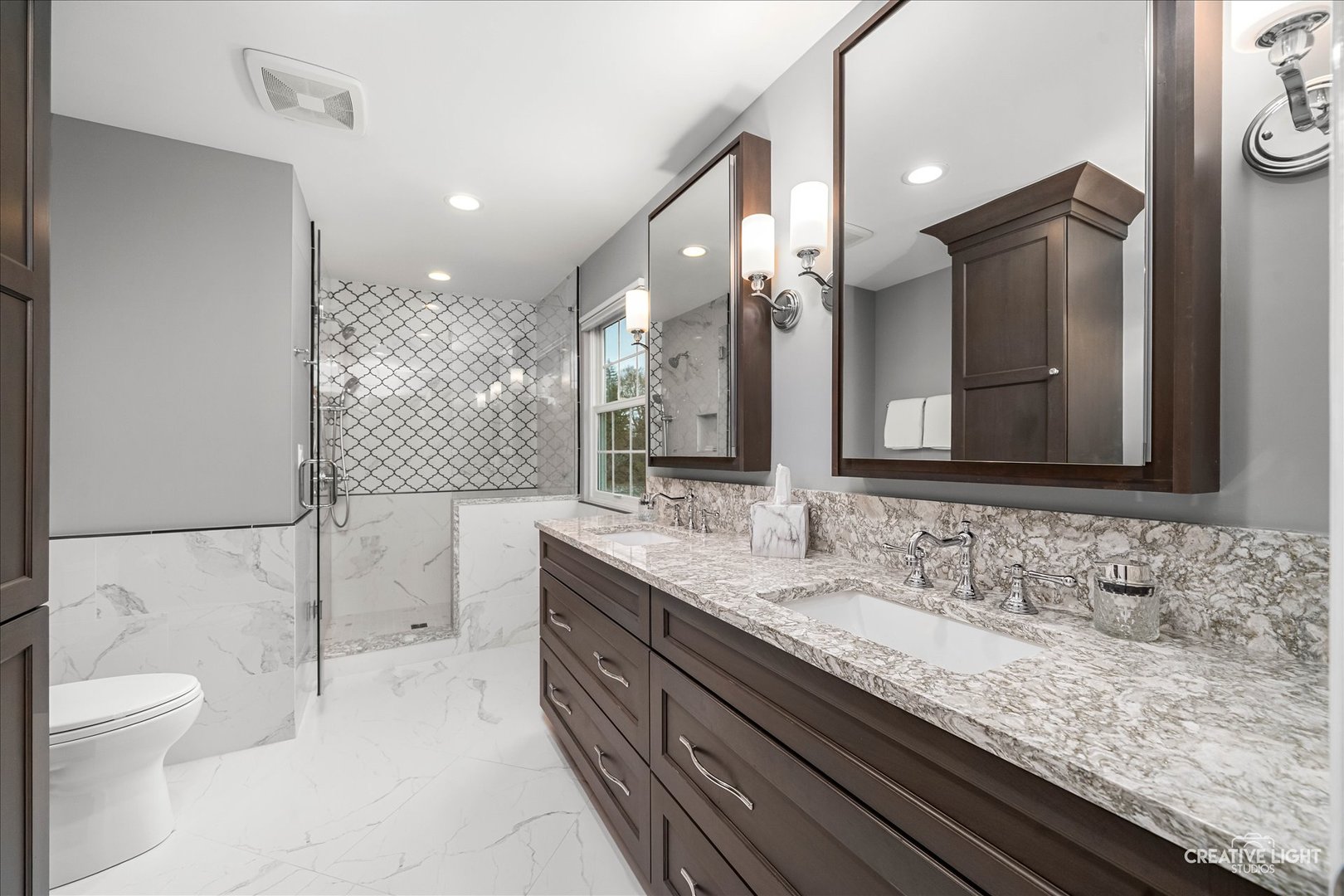 7 Falcon Ridge Court Algonquin, IL 60102 - Photo 29 of 51 a bathroom with a granite countertop sink a toilet and a large mirror