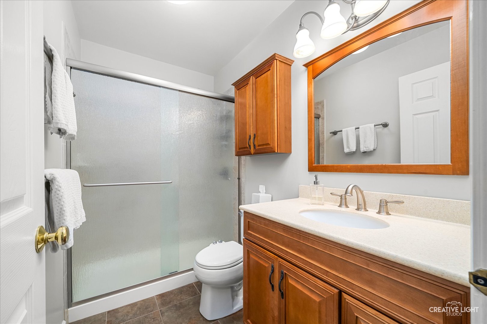 7 Falcon Ridge Court Algonquin, IL 60102 - Photo 40 of 51 a bathroom with a sink a toilet and mirror