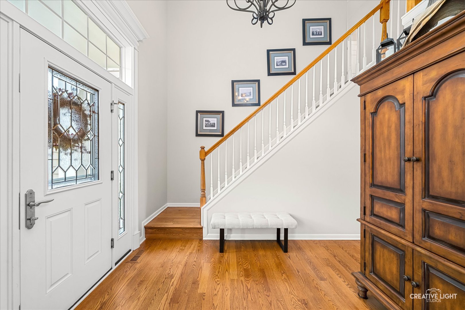 7 Falcon Ridge Court Algonquin, IL 60102 - Photo 4 of 51 a view of entryway with wooden floor and stairs